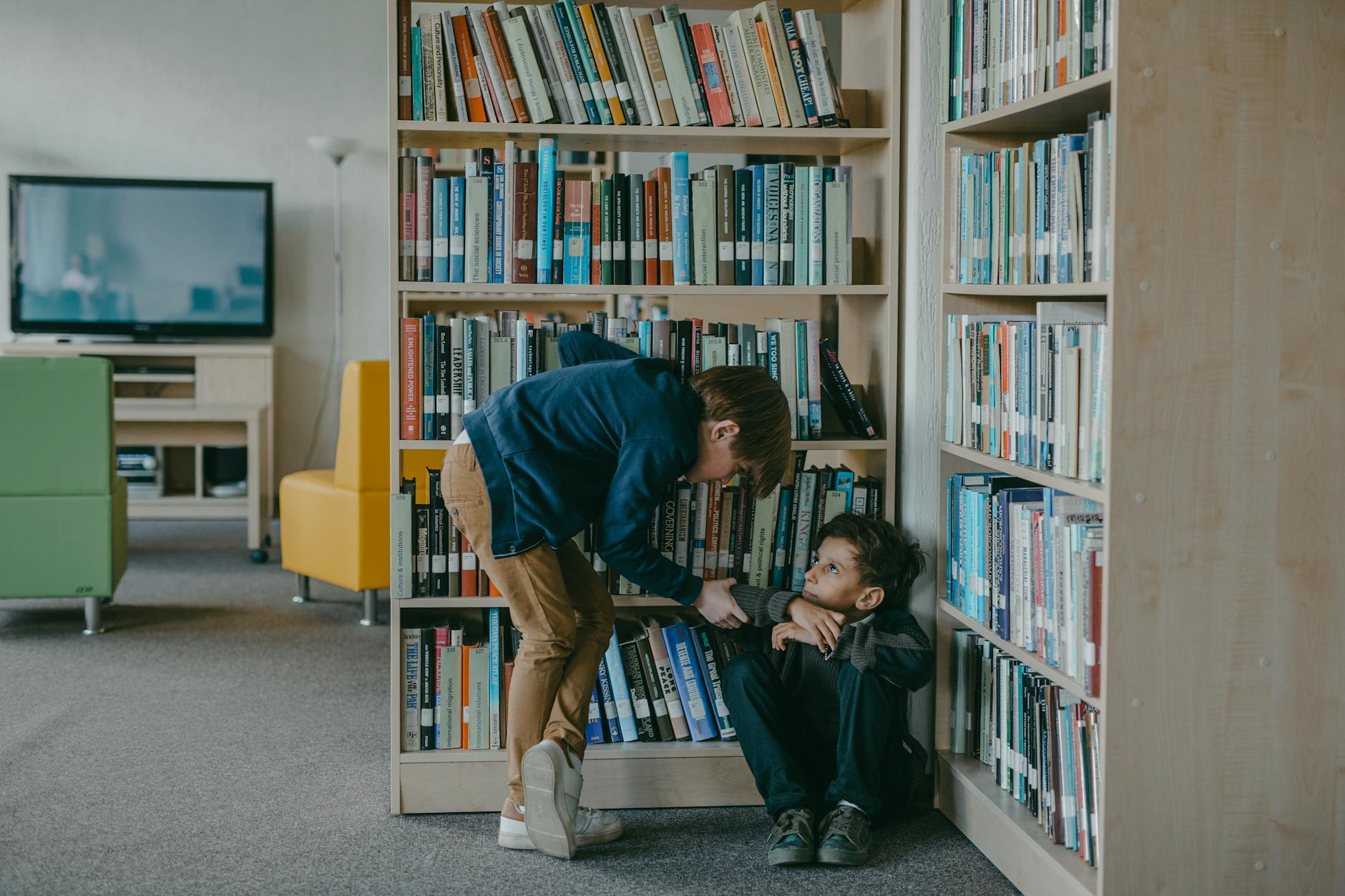 a kid getting bullied in the library